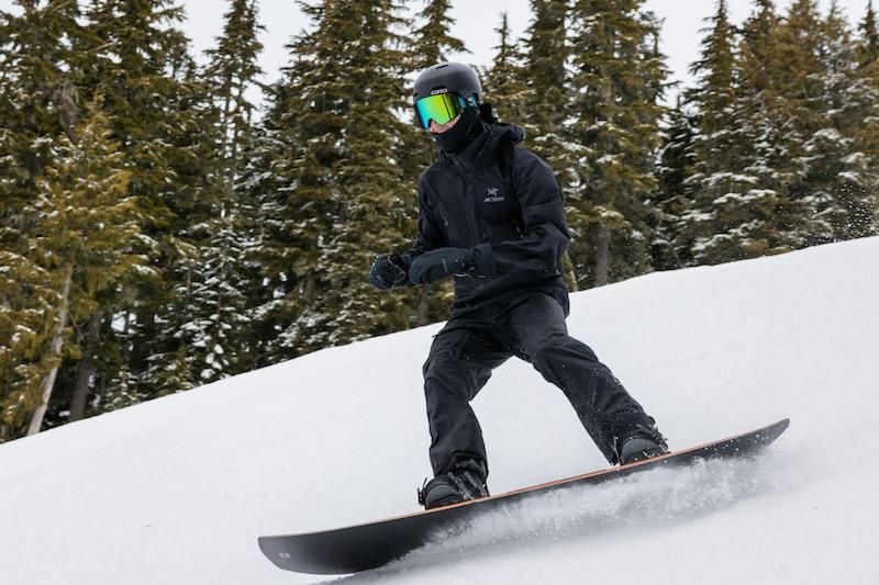 Man riding a twin snowboard