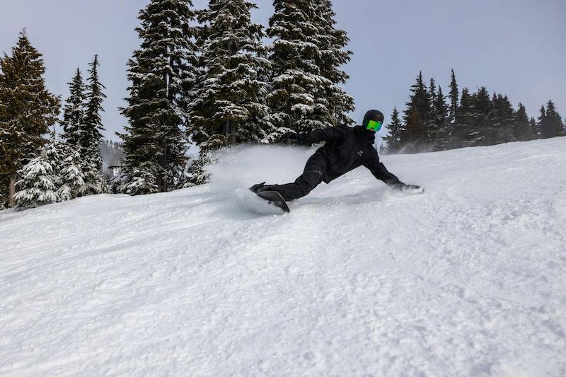 Snowboarder riding the right size snowboard
